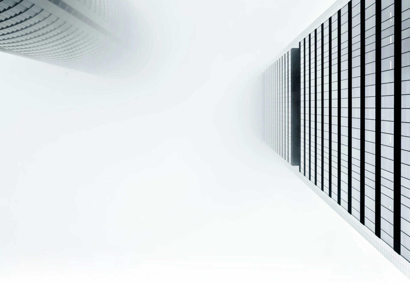 Perspective of many-storeyed abstract buildings on white background rising to top